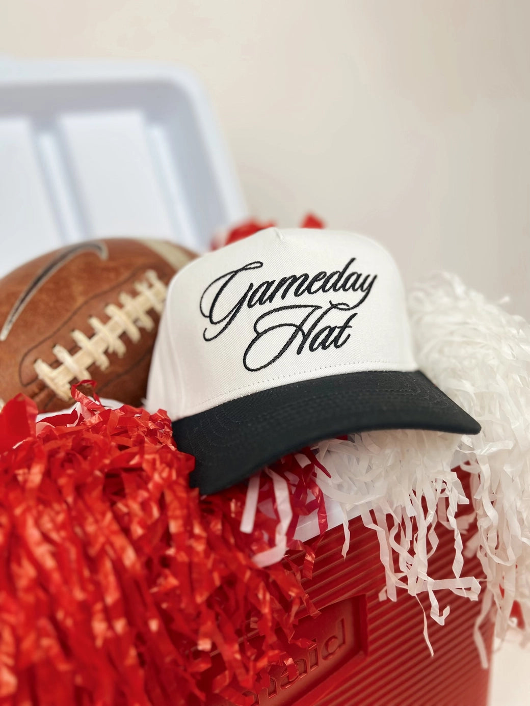 Cursive game day trucker hat